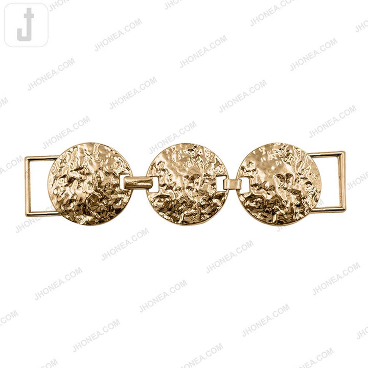 Textured round metal belt buckle in shiny gold 