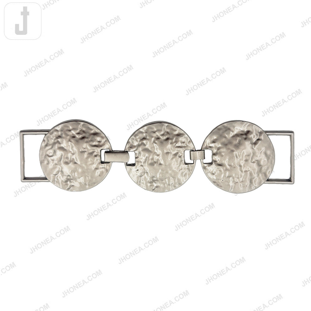 Textured round metal belt buckle in matte silver finish